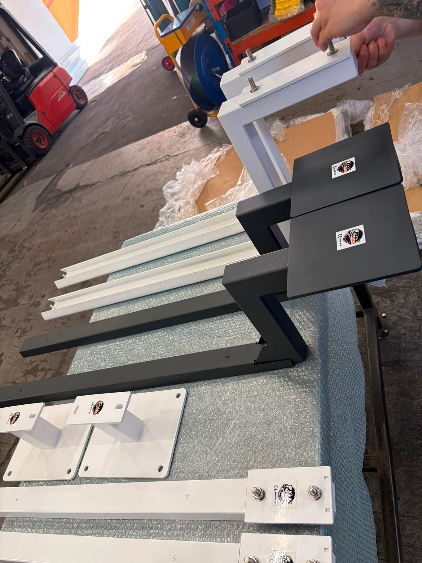 Custom brackets in white and anthracite — assembled and checked before packing (Birmingham UK)