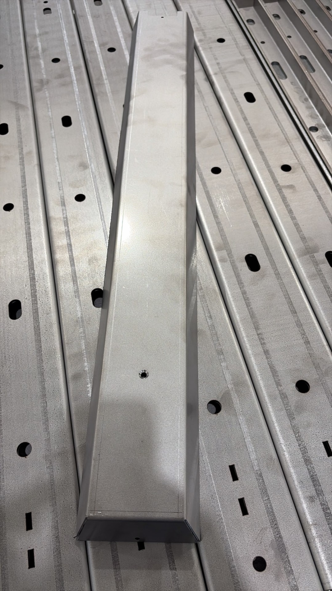 Formed stainless steel bracket cover with countersunk fixing holes