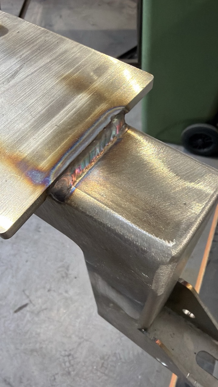 Forged studs positioned on the back plate