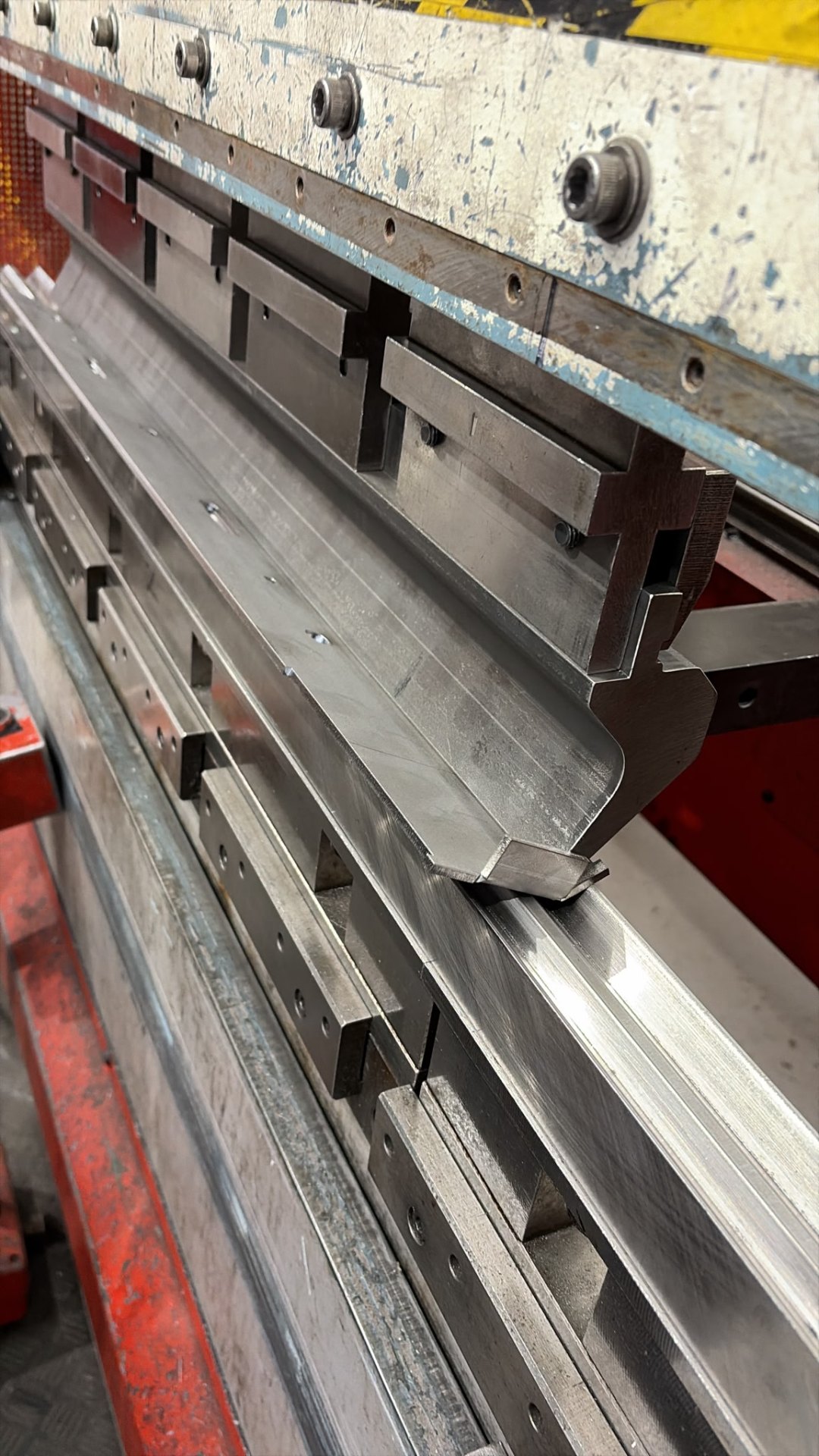 Press brake bending a long stainless steel awning bracket profile