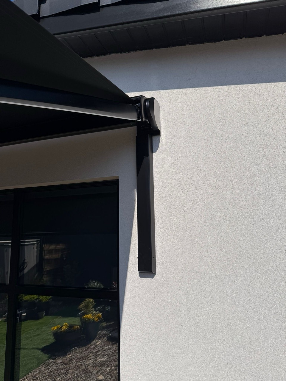 Installed awning bracket — clean architectural finish