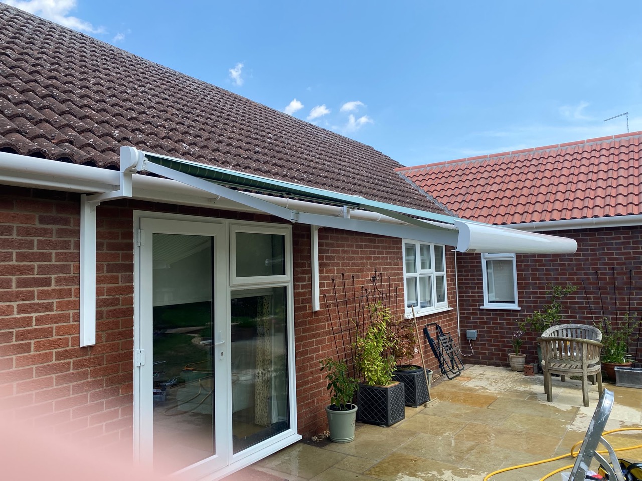 Side view of the gutter bracket install — bracket profile against fascia